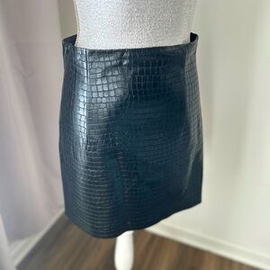Vegan crocodile embossed leather mini skirt.